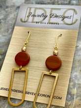 Load image into Gallery viewer, Orange Czech glass beaded earrings with brass charms
