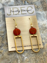 Load image into Gallery viewer, Orange Czech glass beaded earrings with brass charms
