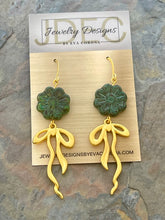 Load image into Gallery viewer, Dark green Czech glass flower statement earrings with bow charms
