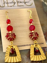 Load image into Gallery viewer, Red and Gold Czech Glass earrings with brass charms
